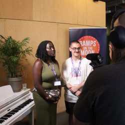 A woman and a man being interviewed
